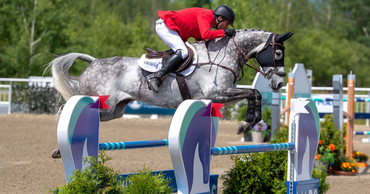 Phillip Dutton and Azure jumping a show jumping fence at Bromont.
