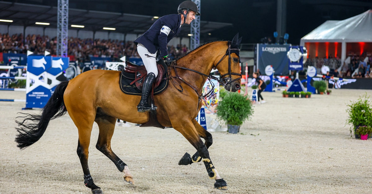 Rider Maikel van der Vleuten and Beauville Z N.O.P. galloping in the ring at Cannes.