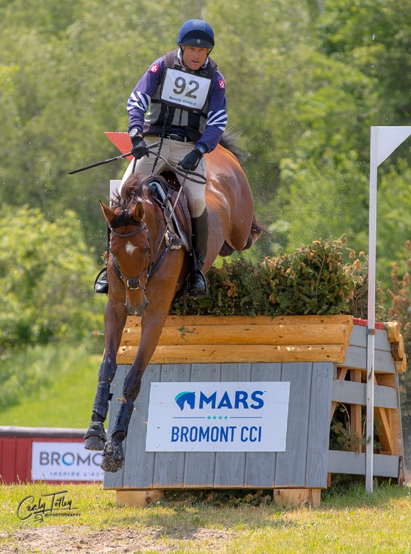 Boyd Martin and On Cue jumping a cross-country fence at Bromont.