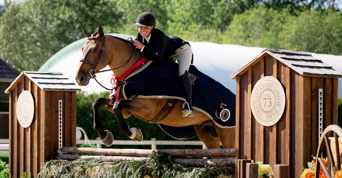 Mariah Barisoff and Quincy jumping a hunter fence.
