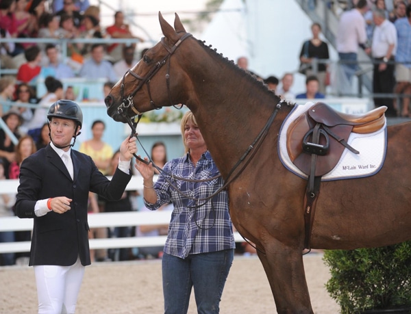 McLain and Erica standing with show jumper Sapphire.