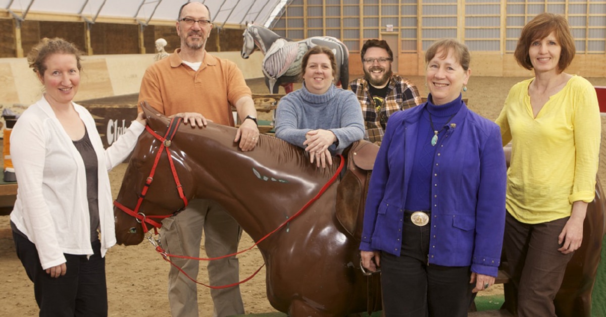 A group of people in an indoor arena.