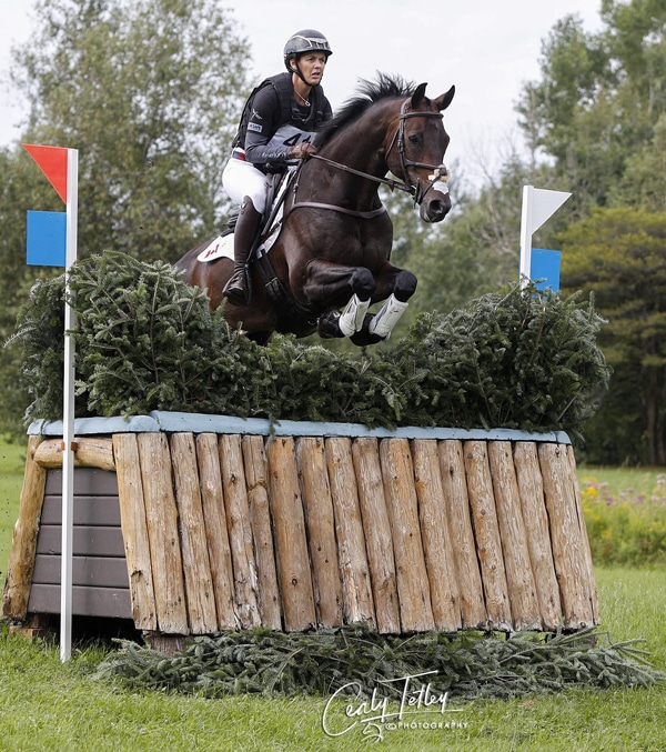 Colleen Loach and FE Golden Eye jumping a cross-country fence at Bromont.