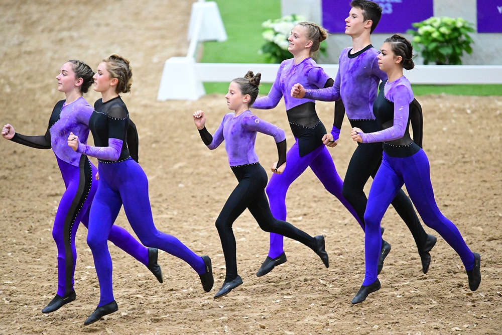 A group of vaulters running.