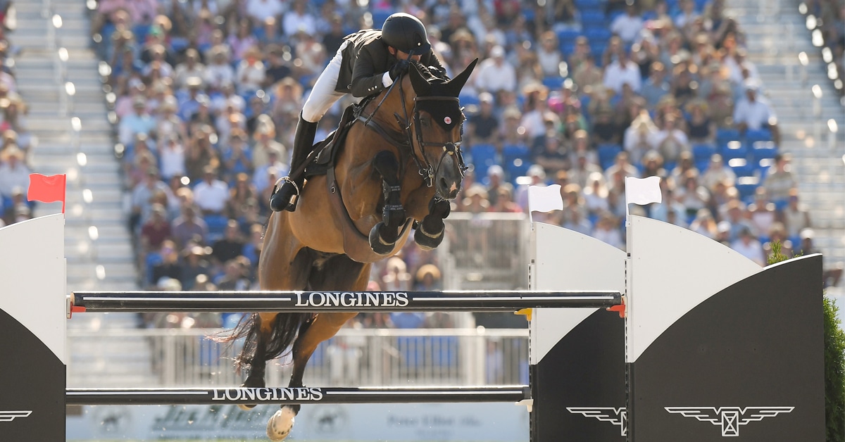 Daniel Bluman and Ladriano Z jumping a fence at the Hampton Classic.