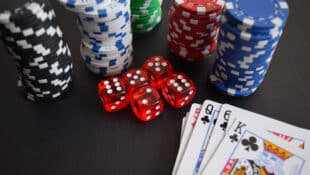 Poker chips, dice and playing cards.