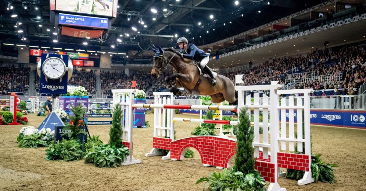 A horse and rider jumping a fence at The Royal.