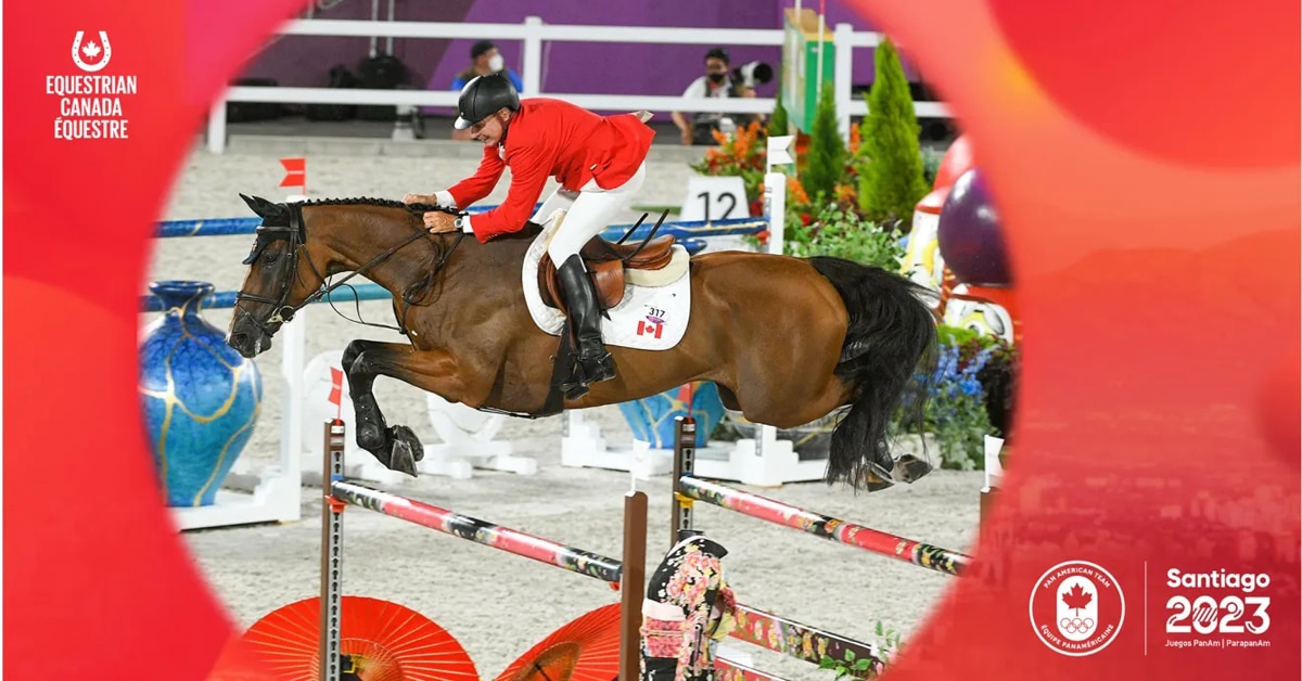 A horse and rider jumping a fence set in a COC border.