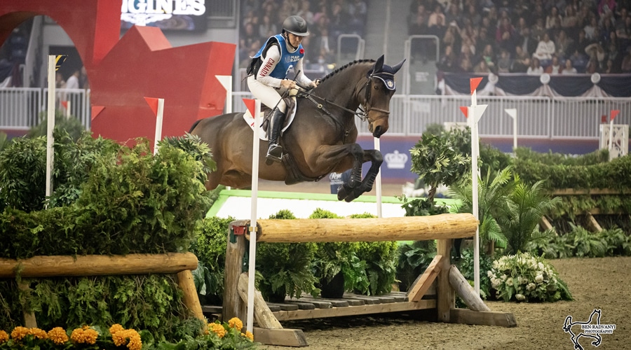 Kendal Lehari and Iron Lorde jumping an indoor eventing fence.