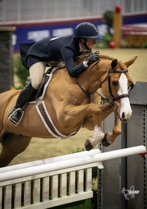Taylor Brooks and Spectre jumping a hunter derby fence.