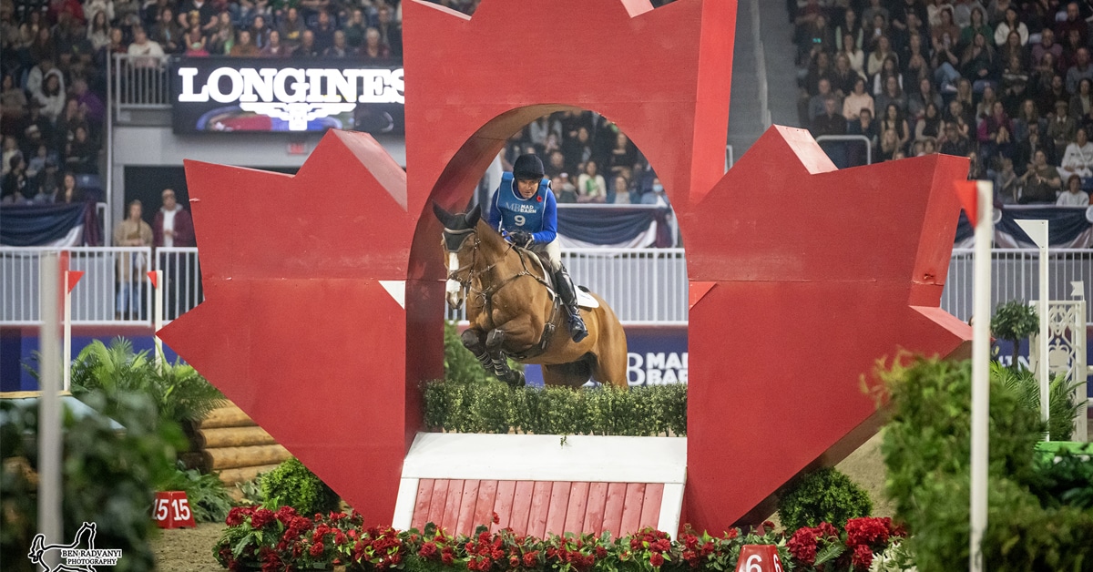 Phillip Dutton and Quasi Cool jumping an indoor eventing fence.
