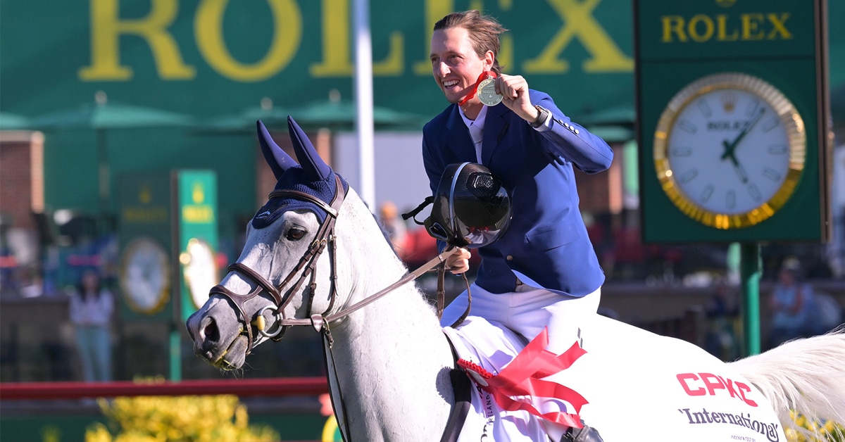 Martin Fuchs and Leone Jei in the victory gallop at Spruce Meadows.