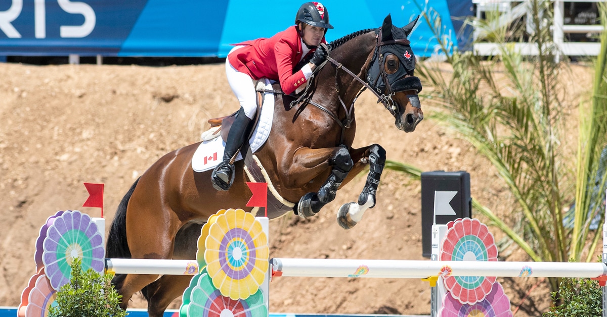 Tiffany Foster and Figor jumping a fence at the Pan Am Games.