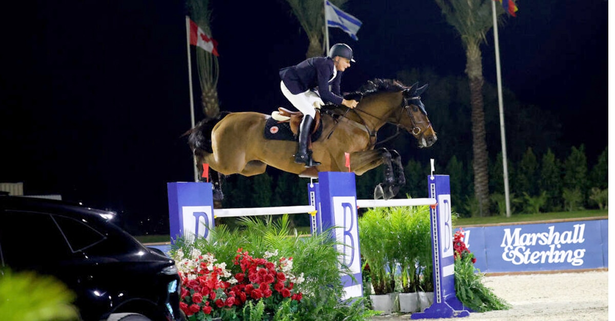 Mario Deslauriers and Bardolina jumping a fence.