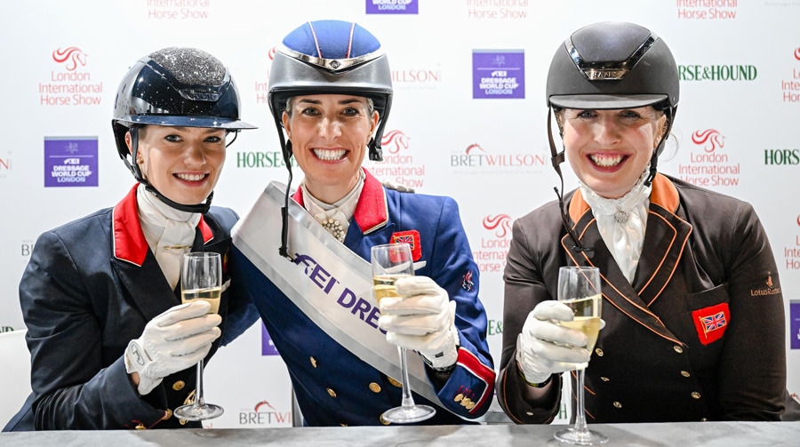Three women holding champagne glasses.