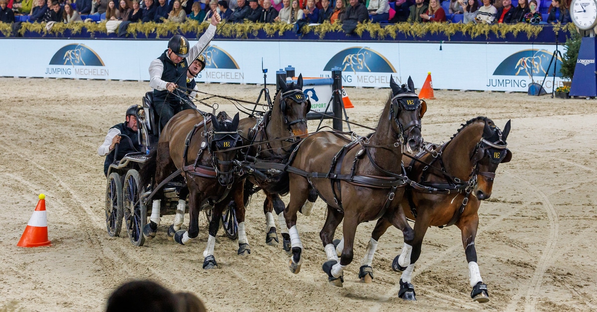A man driving a team of four horses.