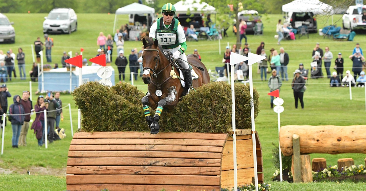 A horse and rider jumping a cross-country fence in Kentucky.