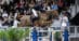 A horse and rider jumping a fence at the World Cup Final.