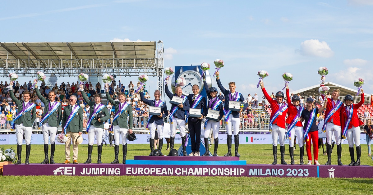 Three teams standing on the podium in Milano.