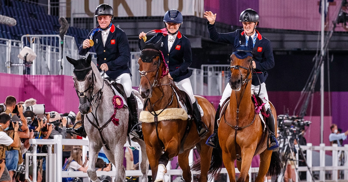 Three event riders during the victory gallop in Tokyo.